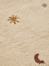 ferm LIVING Skye parchment rug shown flat to display the full celestial pattern