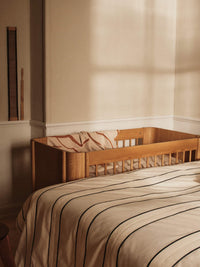 ferm LIVING Skye sienna and parchment blanket styled in a room setting