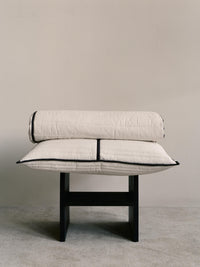 Detail of the ferm LIVING Vari bedspread quilting and dark chocolate piped edge