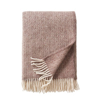 Klippan Lima alpaca and lambswool throw in sand, folded, showing woven diamond pattern and cream fringe