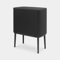 Rear view of the matt black Brabantia Bo Touch Bin on legs