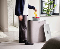 Grey Tota Trio laundry basket showing three sorting compartments