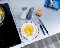 Grey Milltop salt and pepper mills on a kitchen worktop