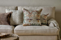 Dantri soft grey cushion cover shown on a pale sofa