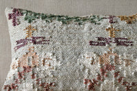 Detail of the muted floral weave on the Dantri cushion cover