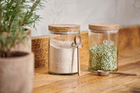 Two Kossi glass storage jars filled with dry goods