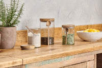 Kossi storage jars styled on a wooden kitchen shelf