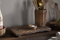 Kaveeta reclaimed wood board styled on a wooden surface