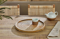 Namuna round tray holding a cup on a table