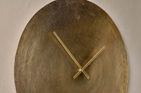 Close-up of the Okota antique brass clock face and hands