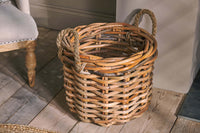 Rattan Chunky Basket with rope handles in a living room setting
