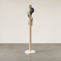 Umbra Flapper coat rack shown full length against a neutral studio wall