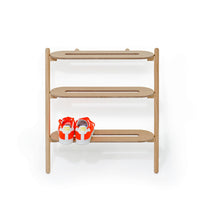 Wireworks Heel Bar leaning shoe rack in oak shown from the front on a white background
