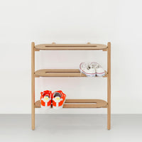 Wireworks Heel Bar oak shoe rack front view holding trainers on a white background