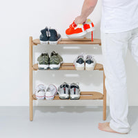 Wireworks Heel Bar oak shoe rack loaded with several pairs of shoes
